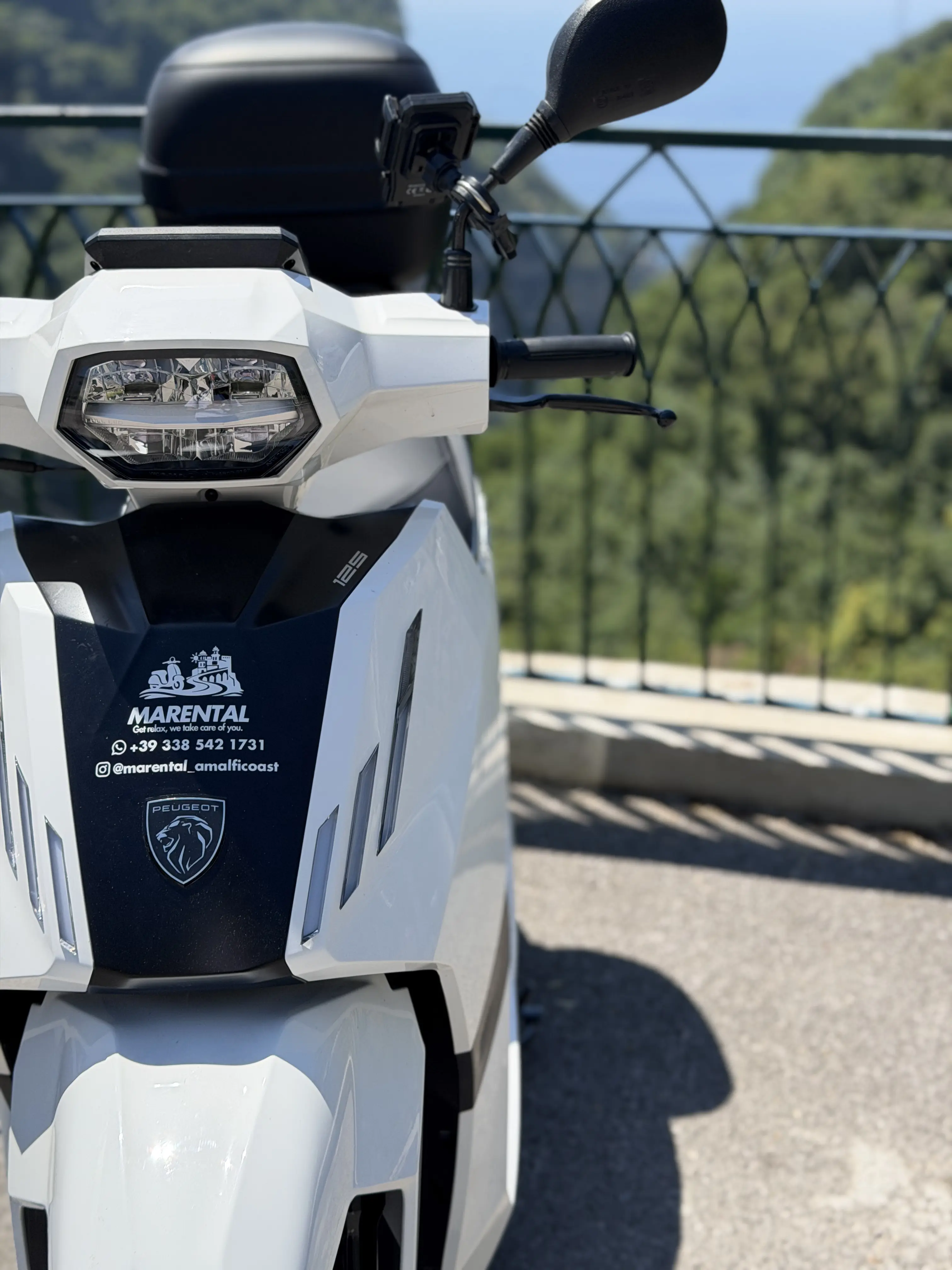 Front close-up of a MARENTAL scooter ready for a coastal ride